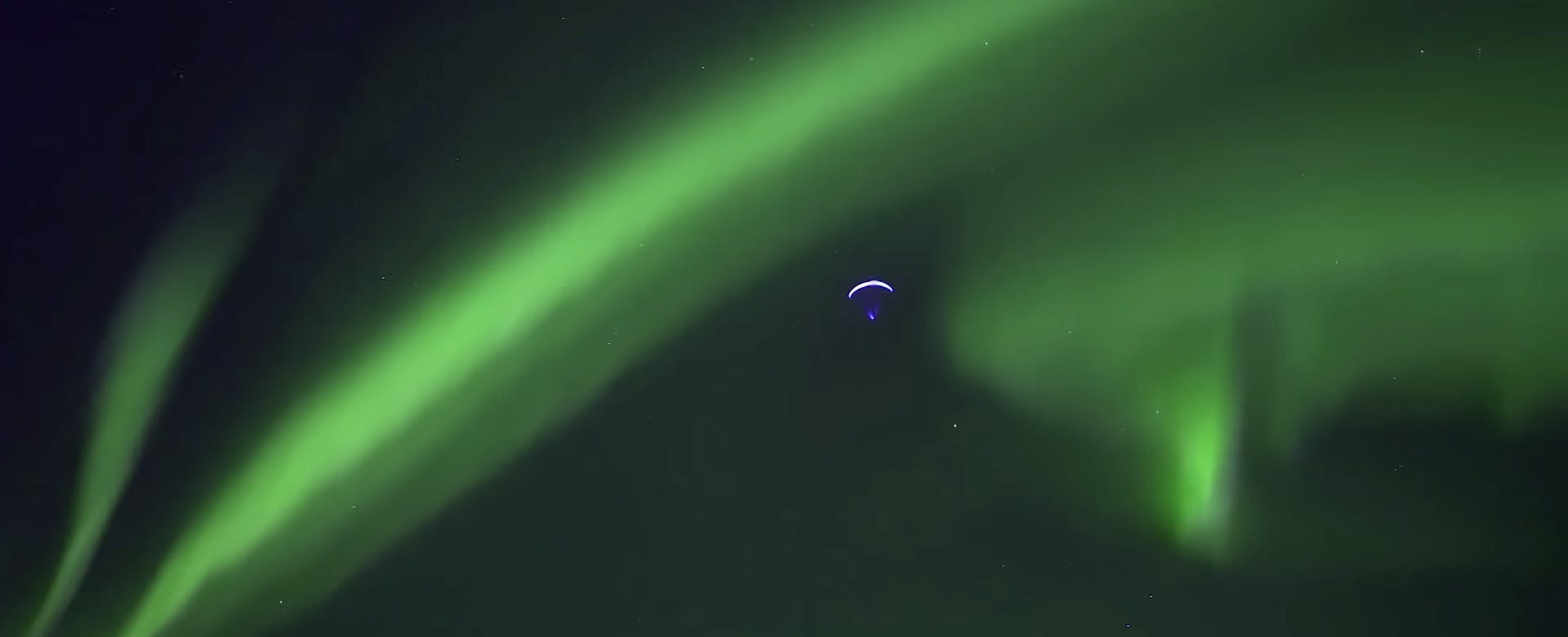 Paragliding through Aurora Borealis